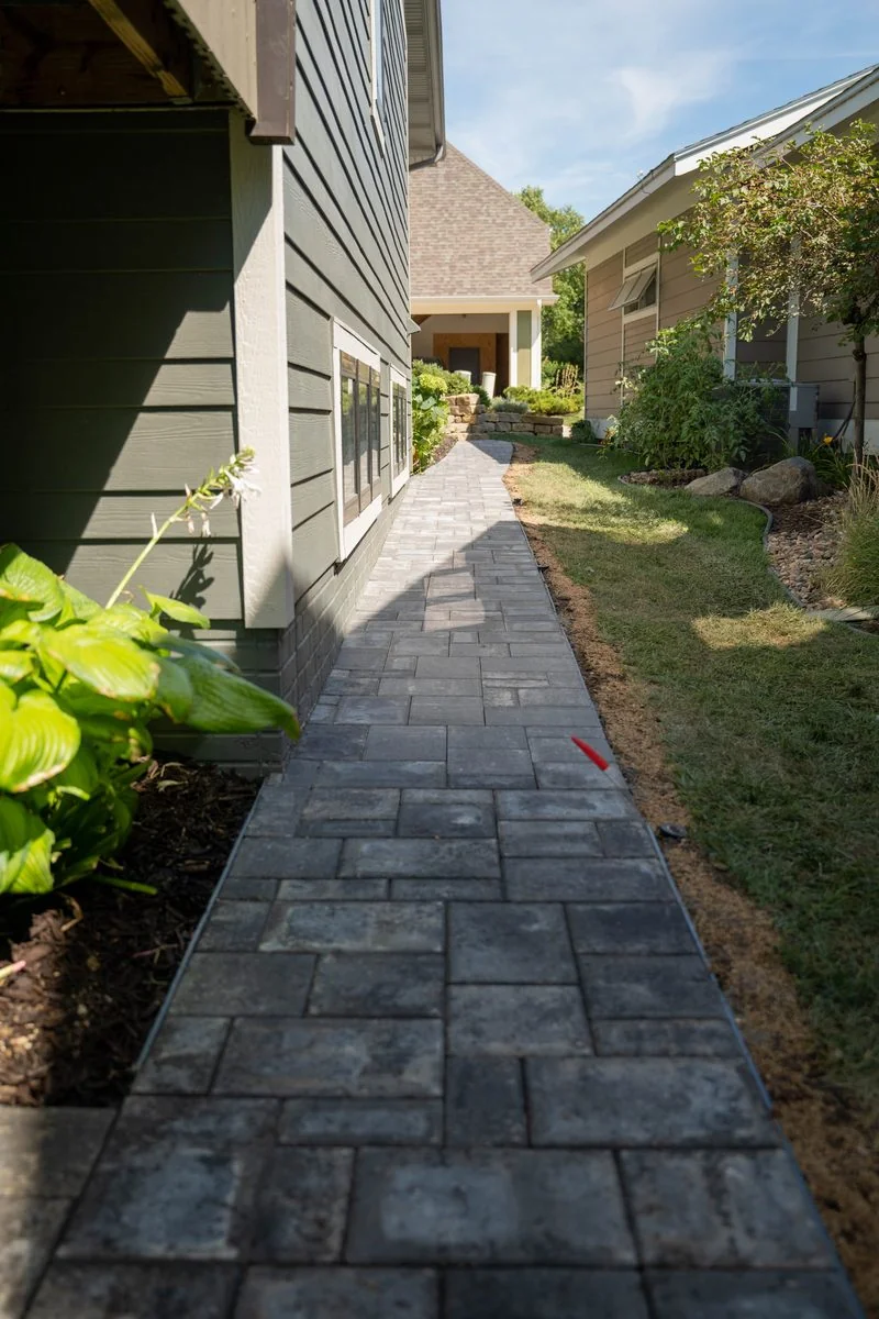 Patio, sitting wall and firepit by Creative Landscaping Lincoln NE